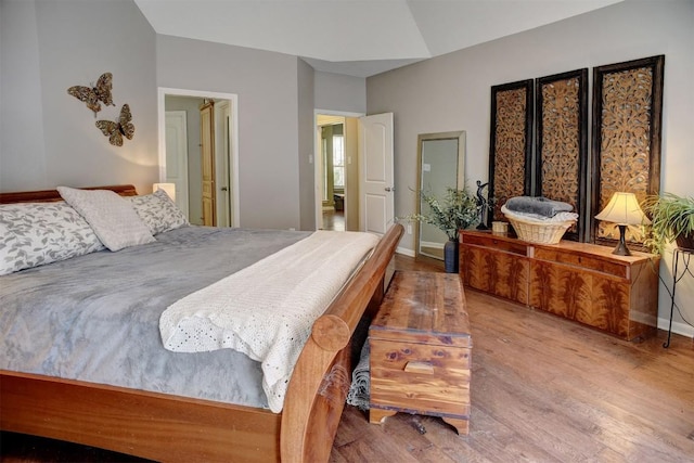 233 Maple Leaf Trl, Elgin, TX 78621 - bedroom featuring wood finished floors and baseboards