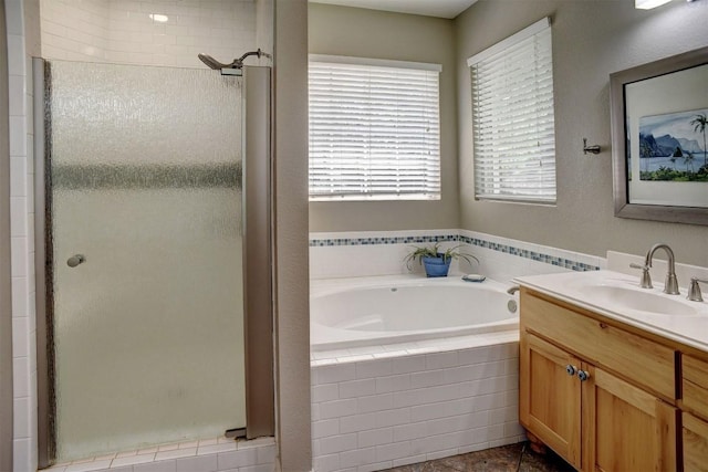 233 Maple Leaf Trl, Elgin, TX 78621 - full bath featuring a shower stall, vanity, a bath, and tile patterned floors