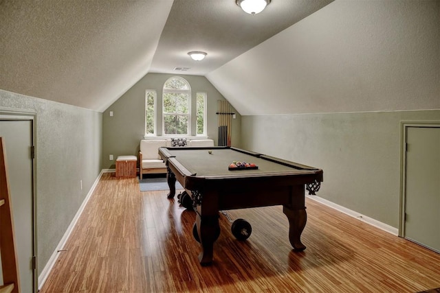 233 Maple Leaf Trl, Elgin, TX 78621 - rec room with wood finished floors, vaulted ceiling, a textured ceiling, billiards table, and baseboards