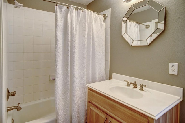 233 Maple Leaf Trl, Elgin, TX 78621 - full bath with shower / bath combo with shower curtain, vanity, and a textured wall
