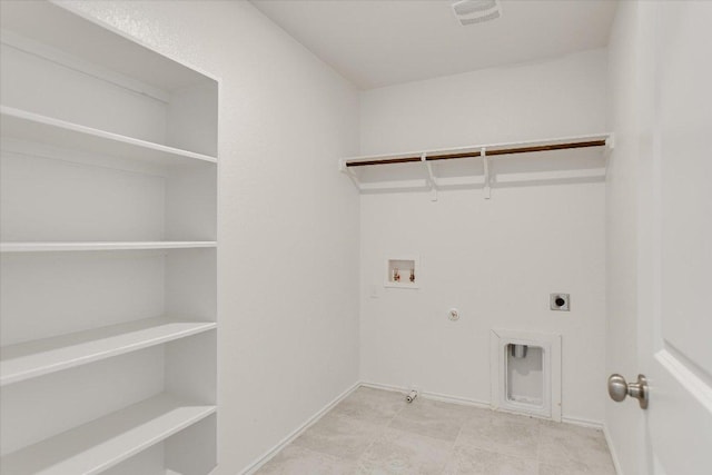 561 Greatest Gift Way, Jarrell, TX 76537 - laundry room with gas dryer hookup, hookup for a washing machine, electric dryer hookup, and baseboards