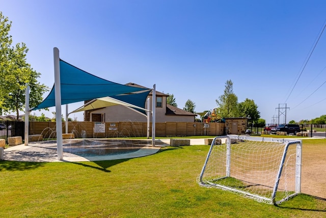 561 Greatest Gift Way, Jarrell, TX 76537 - fenced backyard featuring an area for sports