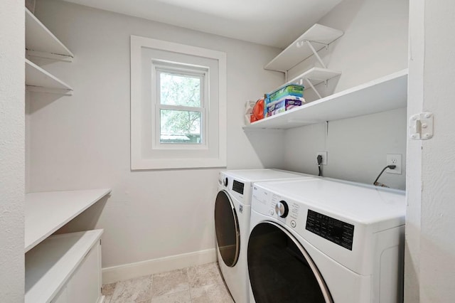 7607 Whispering Winds Dr, Austin, TX 78745 - laundry room with washer and clothes dryer and baseboards