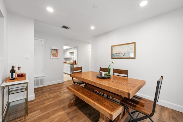 7607 Whispering Winds Dr, Austin, TX 78745 - dining area with baseboards, wood finished floors, and recessed lighting