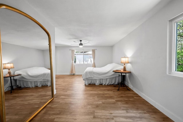 7607 Whispering Winds Dr, Austin, TX 78745 - bedroom with wood finished floors, baseboards, and ceiling fan