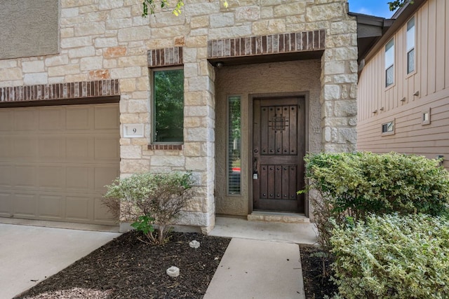 2101 Rivers Edge Way Unit 9, Austin, TX 78741 - entrance to property featuring stone siding and an attached garage