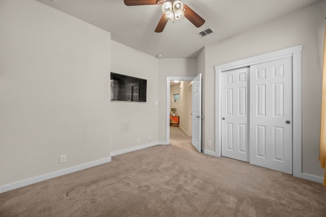 2101 Rivers Edge Way Unit 9, Austin, TX 78741 - unfurnished bedroom featuring carpet floors, baseboards, a closet, and ceiling fan
