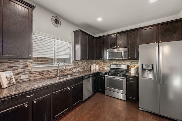 2101 Rivers Edge Way Unit 9, Austin, TX 78741 - kitchen featuring stainless steel appliances, a sink, dark stone counters, and recessed lighting