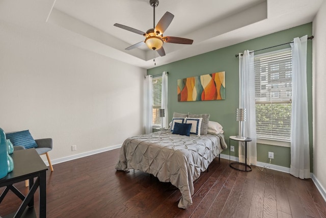 2101 Rivers Edge Way Unit 9, Austin, TX 78741 - bedroom with a tray ceiling, wood finished floors, baseboards, and ceiling fan
