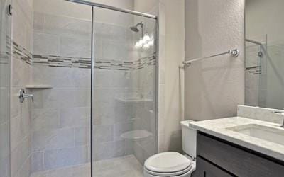 4720 Napoli Shore Dr, Leander, TX 78641 - full bathroom with toilet, a stall shower, and vanity