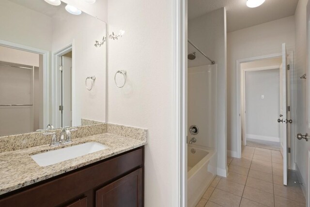 7109 Bargello Pl, Round Rock, TX 78665 - bathroom with tile patterned flooring, vanity, shower / washtub combination, and baseboards