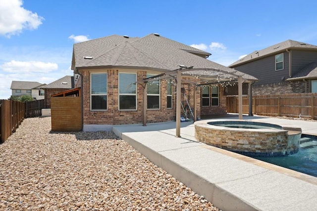 7109 Bargello Pl, Round Rock, TX 78665 - rear view of property with a pergola, a fenced backyard, brick siding, and a pool with connected hot tub