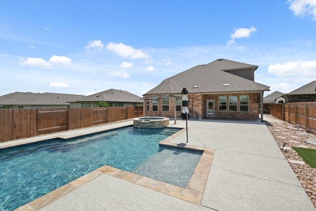 7109 Bargello Pl, Round Rock, TX 78665 - view of pool with a patio, a fenced backyard, and a pool with connected hot tub