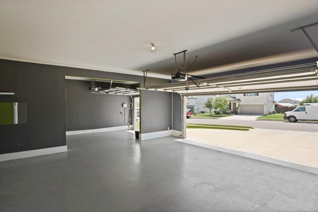 7109 Bargello Pl, Round Rock, TX 78665 - garage featuring a garage door opener and baseboards