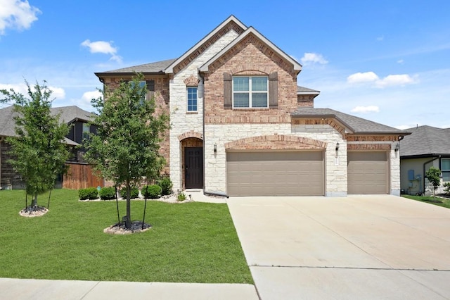 7109 Bargello Pl, Round Rock, TX 78665 - view of front of property with driveway, stone siding, and brick siding