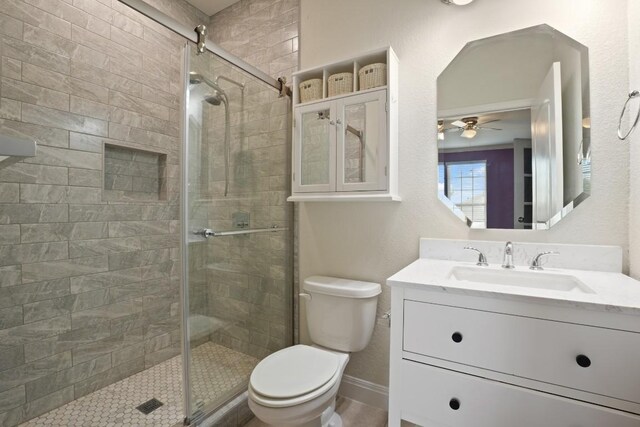 7109 Bargello Pl, Round Rock, TX 78665 - bathroom featuring a shower stall, vanity, and ceiling fan