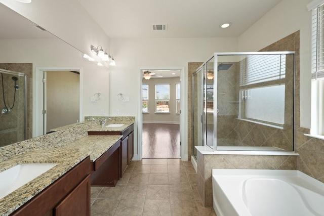 7109 Bargello Pl, Round Rock, TX 78665 - full bathroom featuring double vanity, a shower stall, a bath, tile patterned floors, and recessed lighting