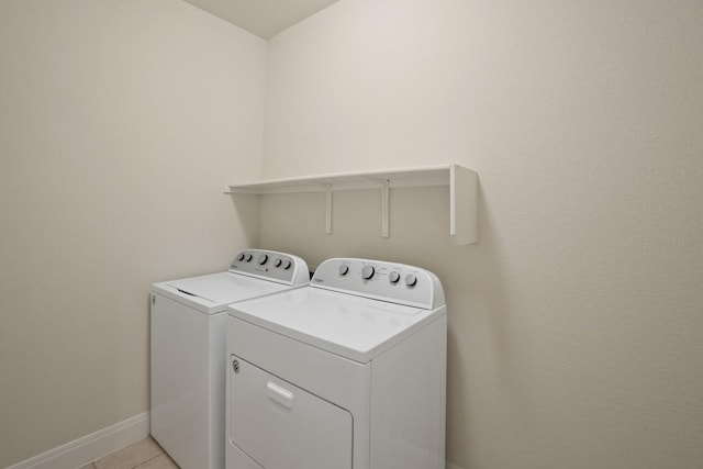 7109 Bargello Pl, Round Rock, TX 78665 - laundry room with independent washer and dryer, baseboards, and light tile patterned floors