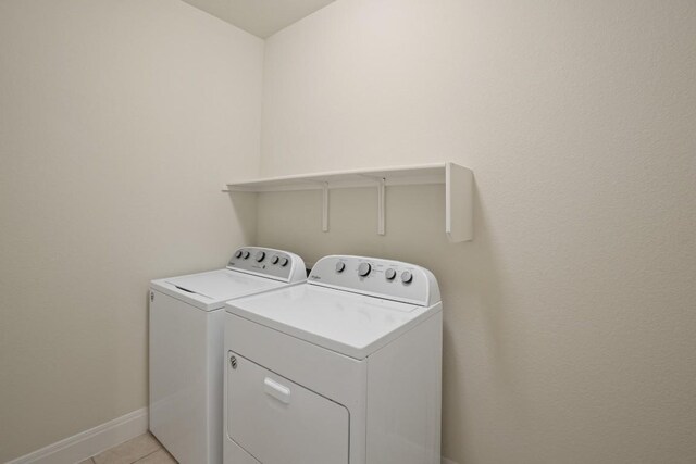 7109 Bargello Pl, Round Rock, TX 78665 - laundry room with separate washer and dryer and light tile patterned flooring