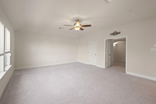 7109 Bargello Pl, Round Rock, TX 78665 - spare room featuring a ceiling fan, light carpet, and baseboards
