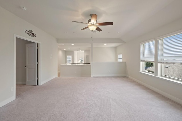 7109 Bargello Pl, Round Rock, TX 78665 - unfurnished living room featuring a ceiling fan, light colored carpet, plenty of natural light, baseboards, and recessed lighting