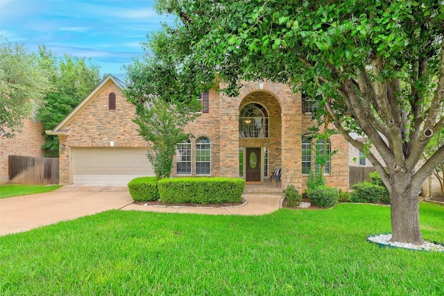10129 Brimfield Dr, Austin, TX 78726 - traditional home with concrete driveway, an attached garage, and brick siding