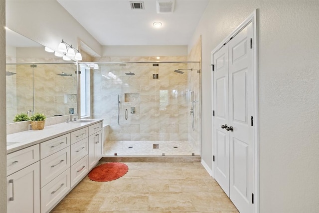 10129 Brimfield Dr, Austin, TX 78726 - bathroom with double vanity and a shower stall