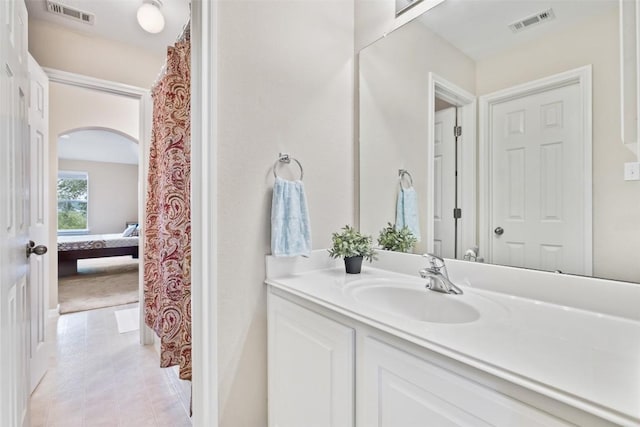 10129 Brimfield Dr, Austin, TX 78726 - full bathroom with vanity, tile patterned floors, and connected bathroom
