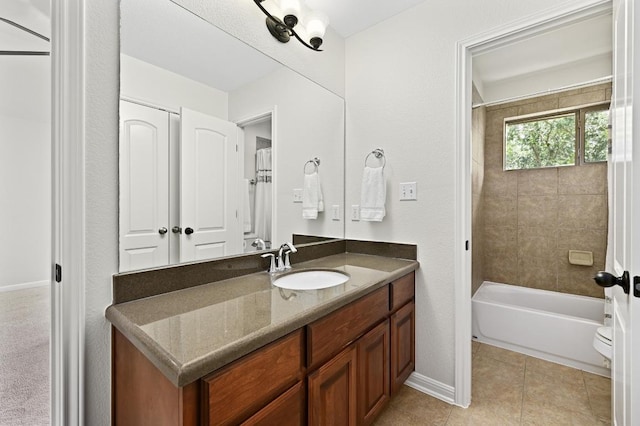 12404 Montclair Bnd, Austin, TX 78732 - bathroom with vanity, bathtub / shower combination, tile patterned flooring, toilet, and baseboards