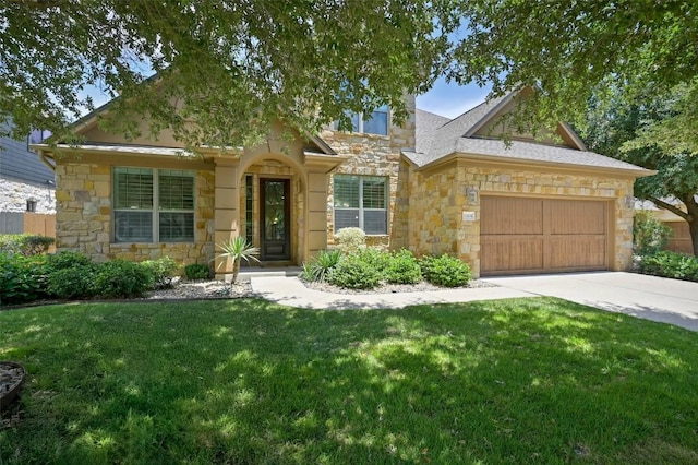 12404 Montclair Bnd, Austin, TX 78732 - view of front facade featuring stone siding, a garage, a front lawn, and concrete driveway