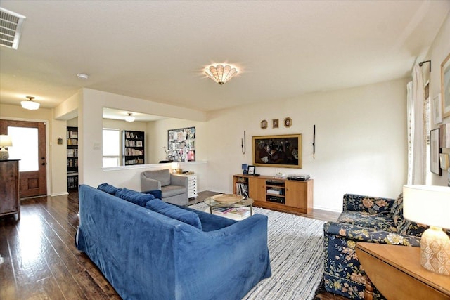 510 W Metcalfe St, Hutto, TX 78634 - living room featuring dark wood finished floors and baseboards