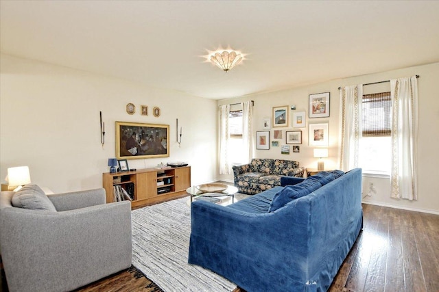 510 W Metcalfe St, Hutto, TX 78634 - living area with plenty of natural light, dark wood-type flooring, and baseboards