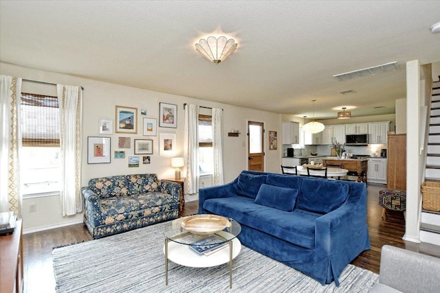 510 W Metcalfe St, Hutto, TX 78634 - living room with dark wood-style floors and baseboards