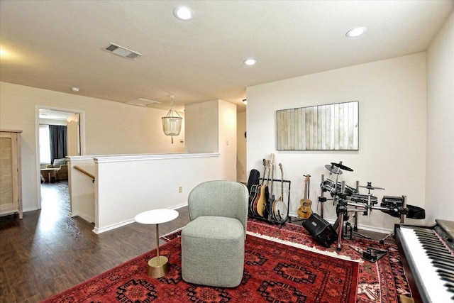 510 W Metcalfe St, Hutto, TX 78634 - sitting room featuring an upstairs landing, wood finished floors, baseboards, and recessed lighting