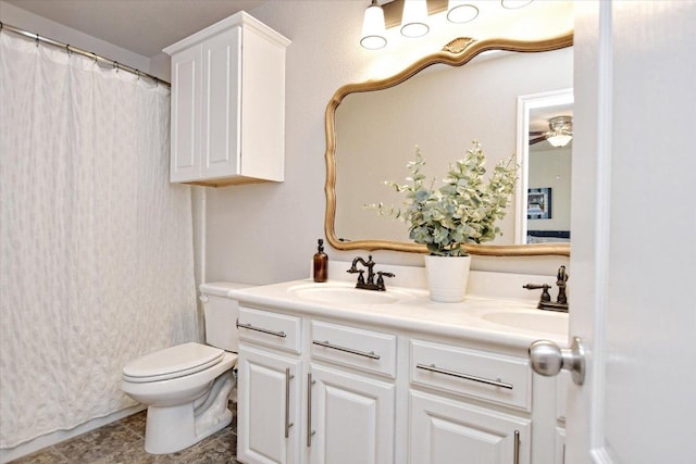 510 W Metcalfe St, Hutto, TX 78634 - full bath featuring double vanity, toilet, a ceiling fan, and a shower with curtain