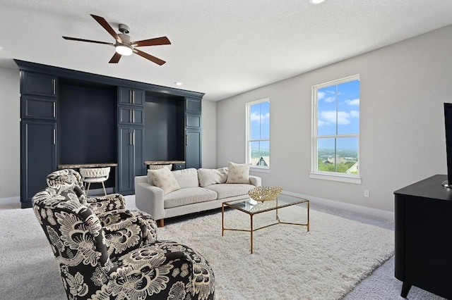 467 Cortaro Dr, Dripping Springs, TX 78620 - living room featuring a ceiling fan, carpet flooring, and baseboards