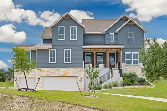 467 Cortaro Dr, Dripping Springs, TX 78620 - view of front of home featuring stone siding, a standing seam roof, board and batten siding, and a front lawn
