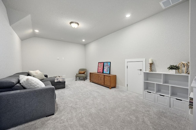 467 Cortaro Dr, Dripping Springs, TX 78620 - sitting room featuring carpet floors, vaulted ceiling, a textured ceiling, recessed lighting, and baseboards