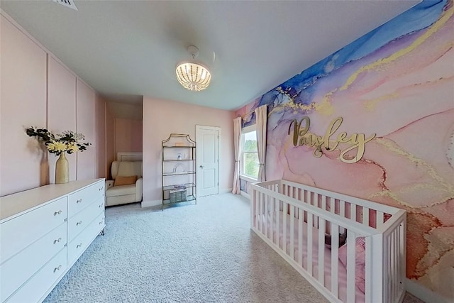 467 Cortaro Dr, Dripping Springs, TX 78620 - bedroom with light colored carpet, a chandelier, baseboards, and a nursery area