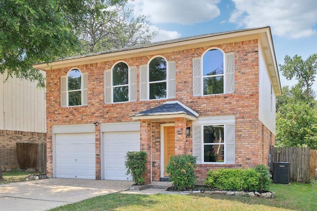 8804 Ravello Pass, Austin, TX 78749 - view of front of home with a garage, concrete driveway, and brick siding