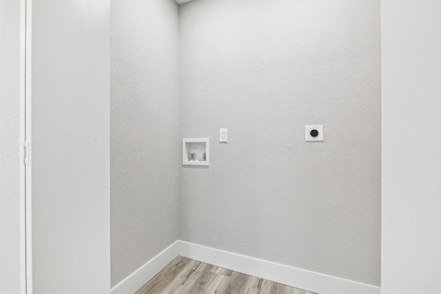 8804 Ravello Pass, Austin, TX 78749 - washroom featuring hookup for an electric dryer, washer hookup, and light wood-style floors
