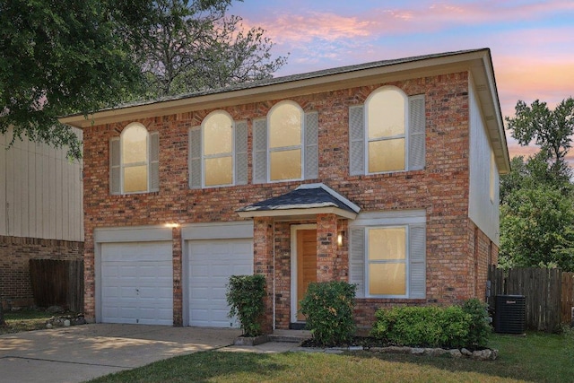 8804 Ravello Pass, Austin, TX 78749 - view of front of house featuring an attached garage, concrete driveway, and brick siding