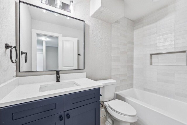 8804 Ravello Pass, Austin, TX 78749 - bathroom featuring a textured wall, vanity, and shower / bathtub combination