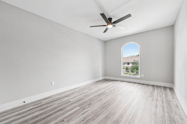 8804 Ravello Pass, Austin, TX 78749 - empty room featuring wood finished floors, a ceiling fan, and baseboards