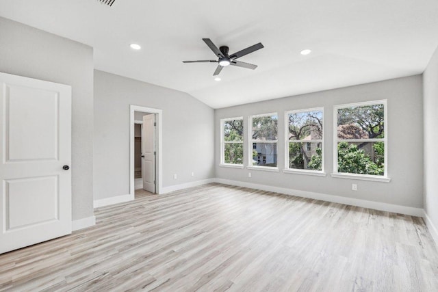 8804 Ravello Pass, Austin, TX 78749 - unfurnished bedroom featuring multiple windows, light wood finished floors, baseboards, recessed lighting, and vaulted ceiling