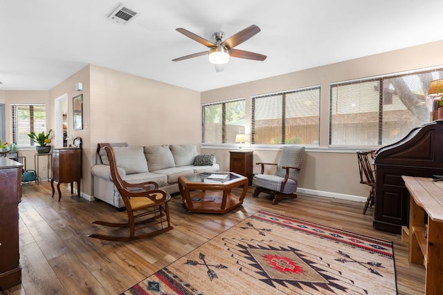 6807 Bill Hughes Rd, Austin, TX 78745 - living room with a ceiling fan, wood-type flooring, and baseboards