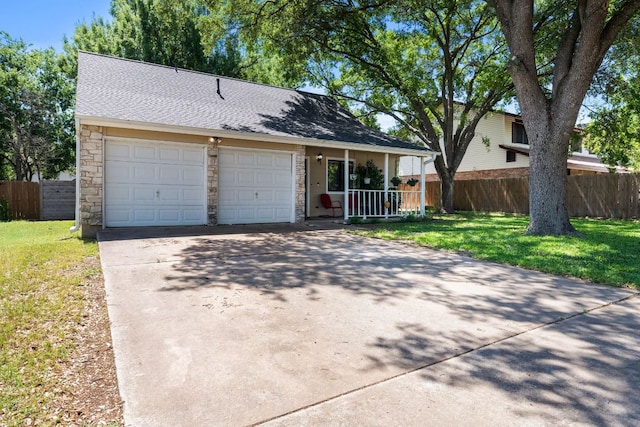 6807 Bill Hughes Rd, Austin, TX 78745 - view of front of home with stone siding, a garage, driveway, a porch, and a shingled roof