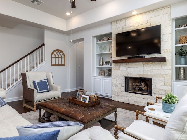 108 Brantley Lake Ln, Georgetown, TX 78628 - living room with stairway, a ceiling fan, dark wood-style floors, and built in features