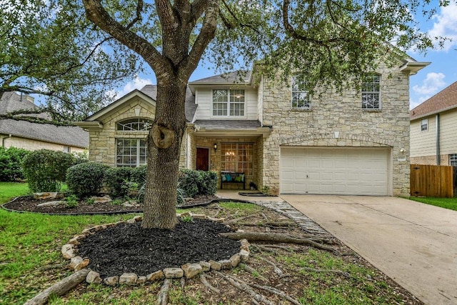 2012 Wood Glen Dr, Round Rock, TX 78681 - traditional-style home featuring stone siding, an attached garage, and concrete driveway