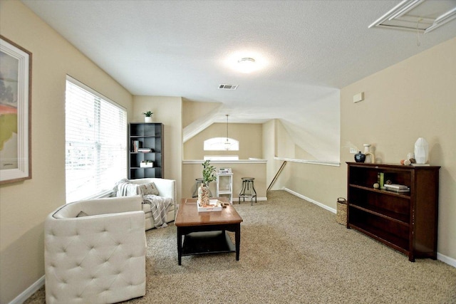 2012 Wood Glen Dr, Round Rock, TX 78681 - carpeted living room featuring attic access and baseboards